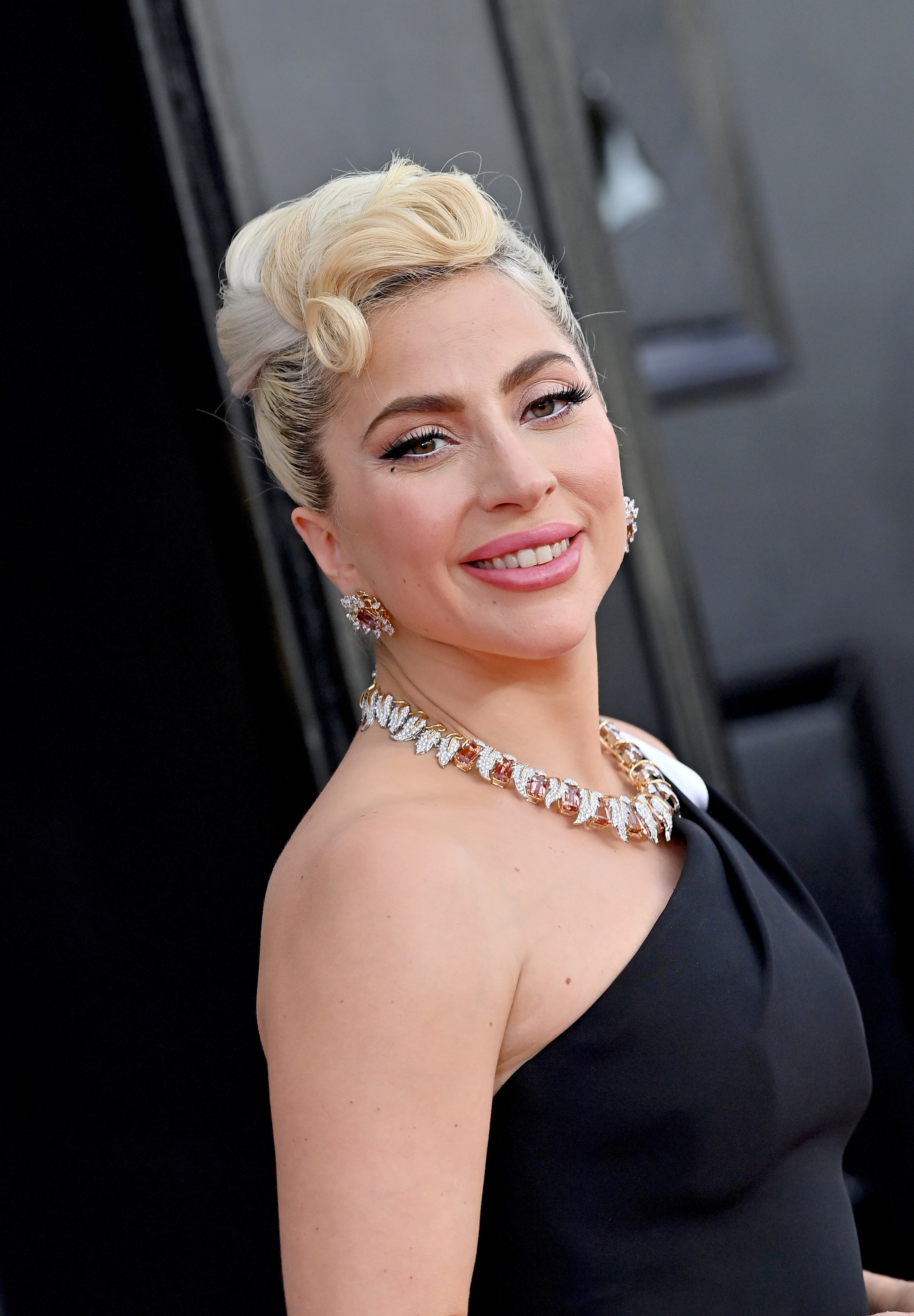 Lady Gaga smiles as she&#x27;s pictured at the Grammy Awards