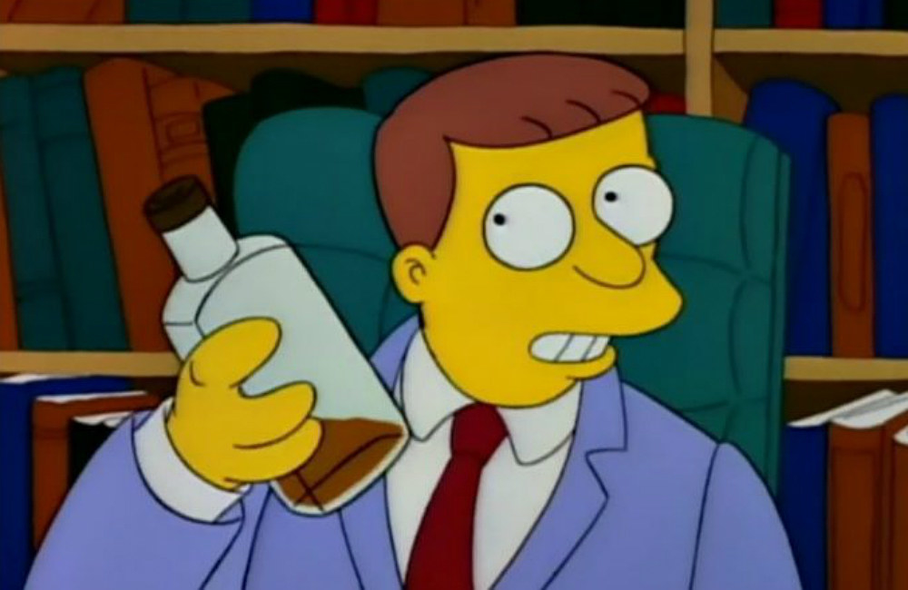 Lionel Hutz sits in a desk chair, a bookshelf behind him, and he&#x27;s holding a near-empty bottle of whiskey