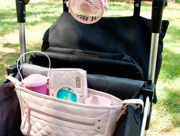 reviewer's photo of the stroller organizer in blush