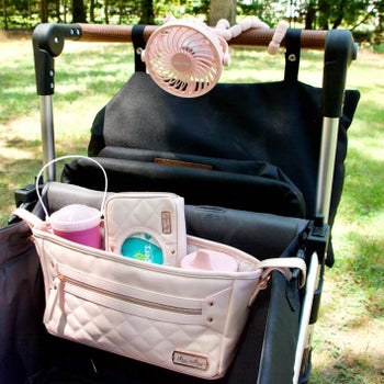 reviewer's photo of the stroller organizer in blush