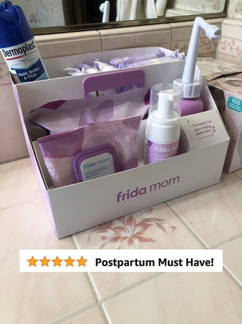 reviewer's photo of the box containing all the postpartum essentials