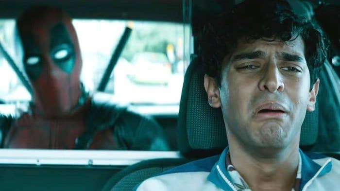 Karan Soni as Dopinder in the front of his Taxi looking scared in Deadpool