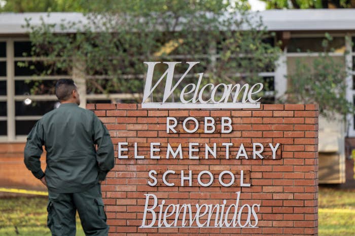 A law enforcement officer stands outside the Robb Elementary School on May 25, 2022 in Uvalde, Texas.