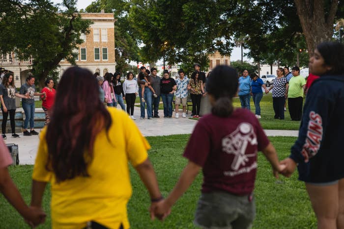 Members of the community gather at the City of Uvalde Town Square for a prayer vigil in the wake of a mass shooting at Robb Elementary School on May 24, 2022 in Uvalde, Texas.