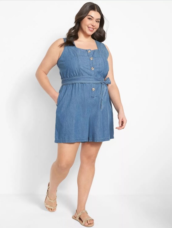 An image of a model wearing a sleeveless square-neck, button-down romper