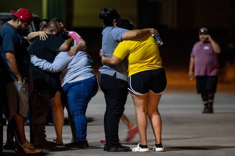 A family grieves outside of the SSGT Willie de Leon Civic Center following the mass shooting at Robb Elementary School on May 24, 2022 in Uvalde, Texas.