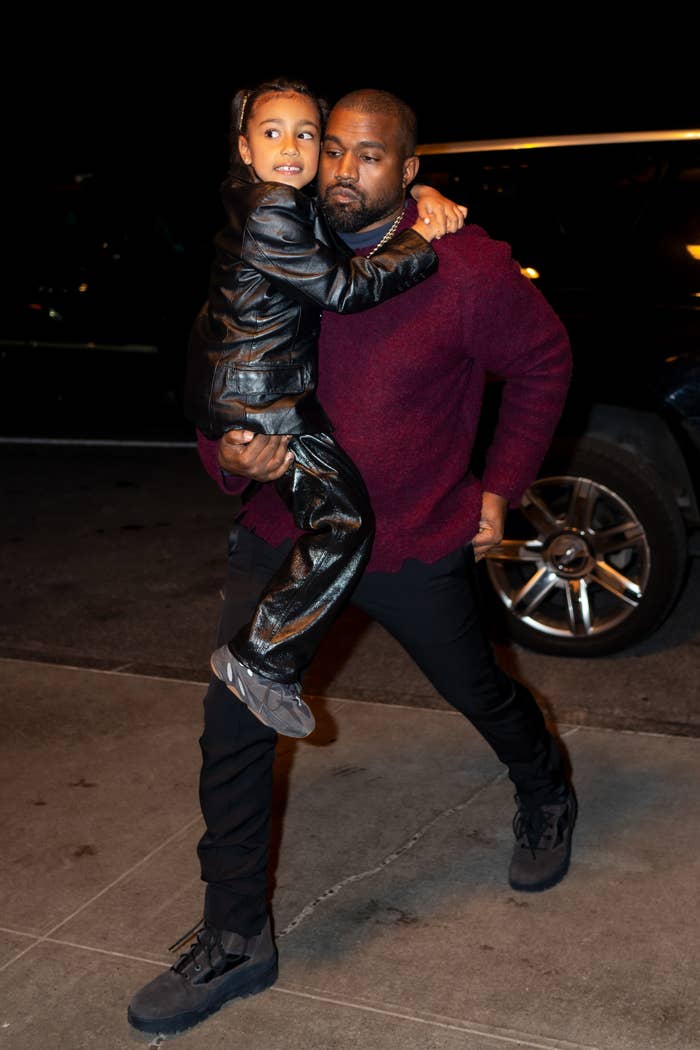 Kanye holding North