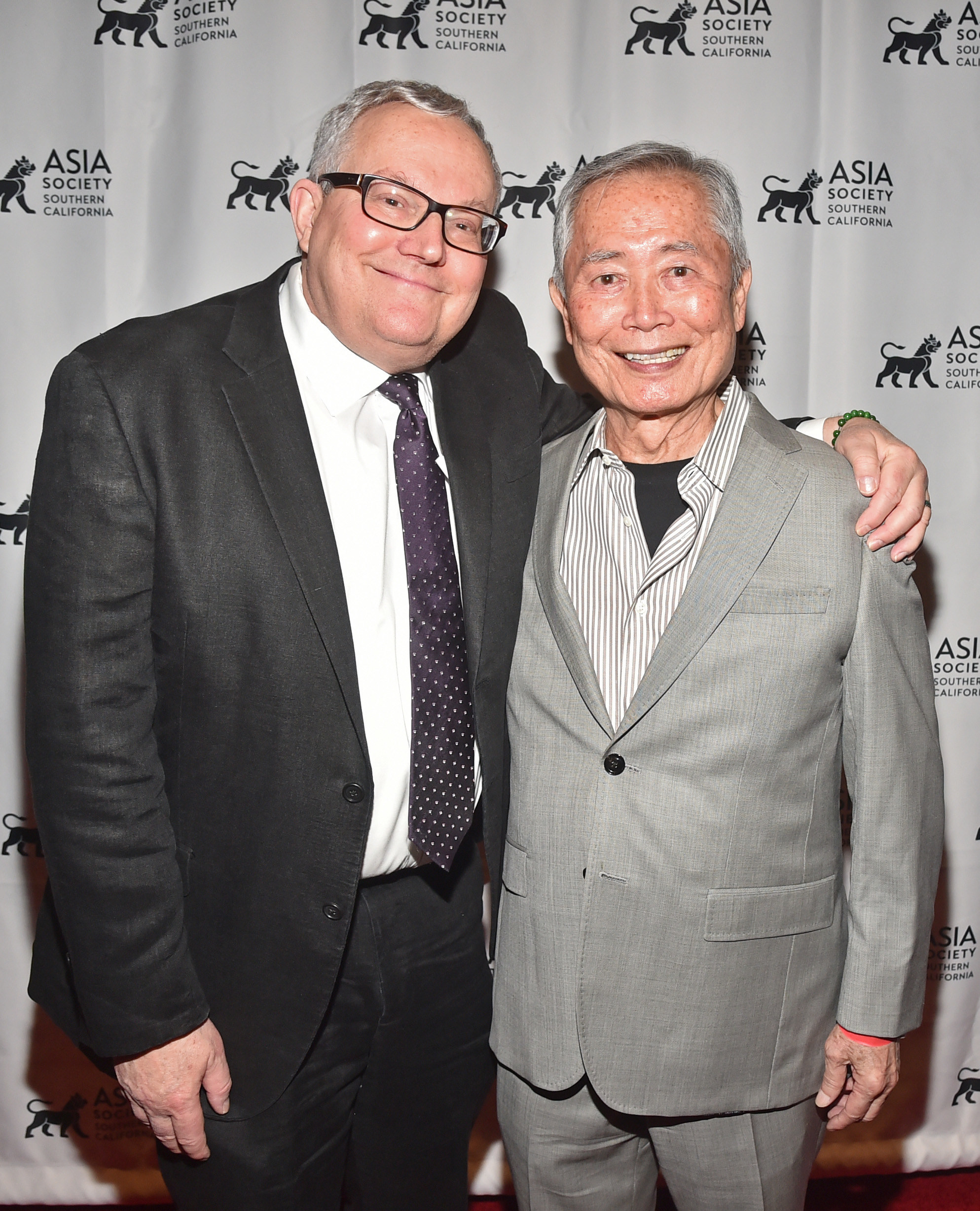 Brad and George Takei at an event