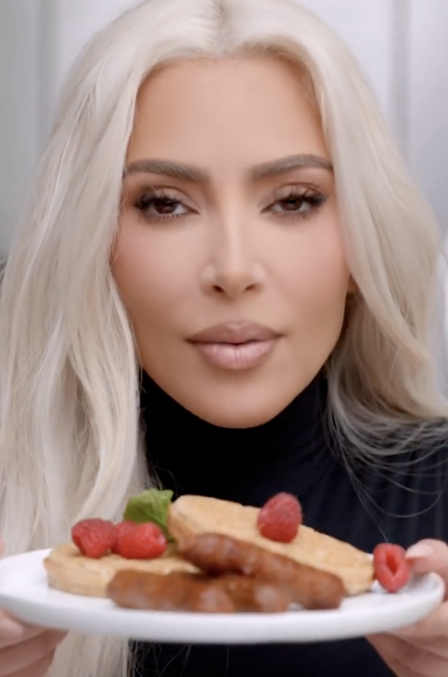 In the promotional video, Kim holds up a plate of waffles with Beyond sausage links