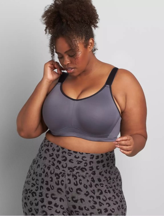 An image of a model wearing a high-impact wicking underwire sports bra with adjustable straps