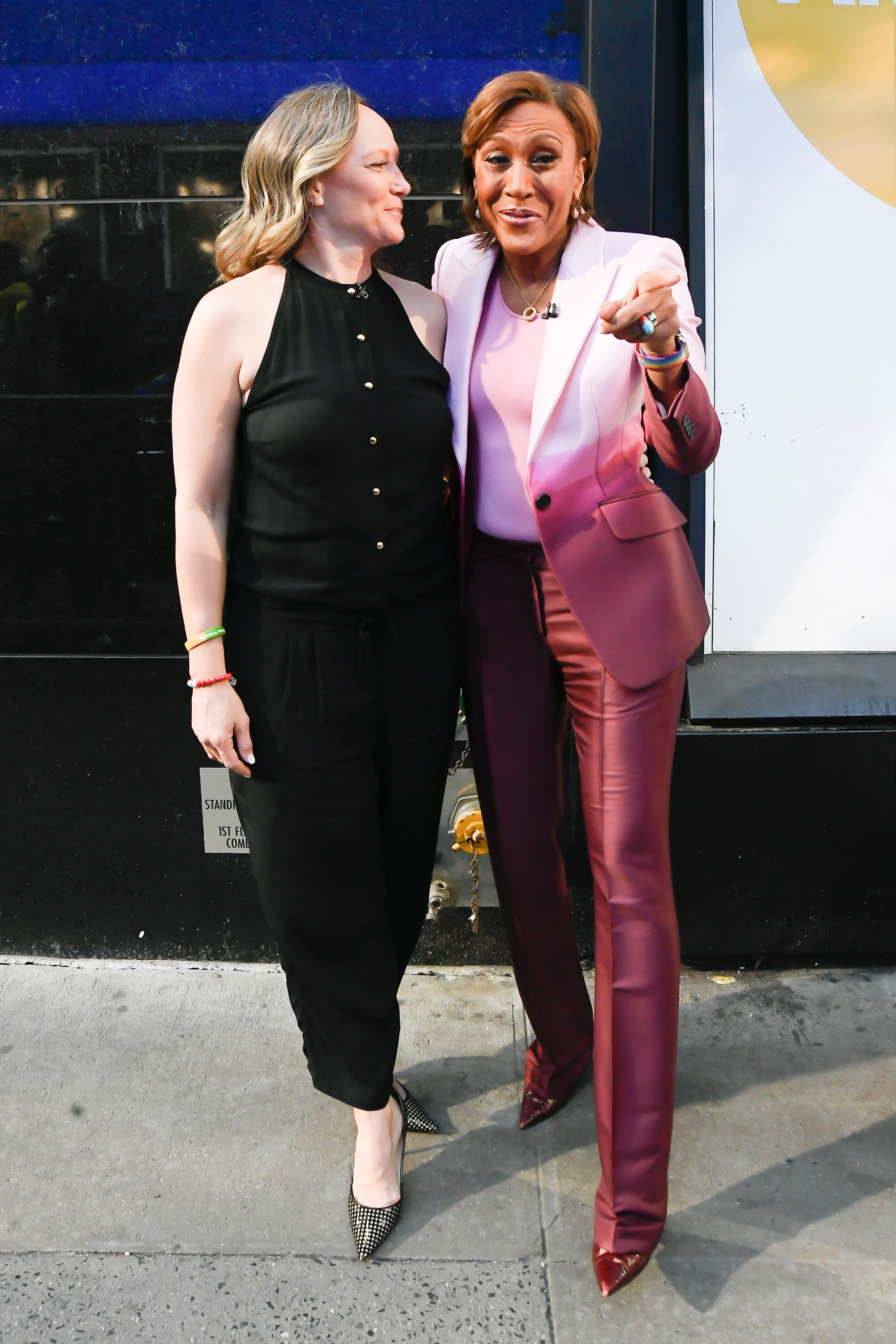 Robin Roberts and Amber Laign stand on a sidewalk together
