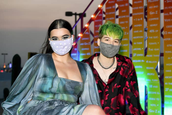 Barbara Ferreira and Elle Puckett wear masks at an event