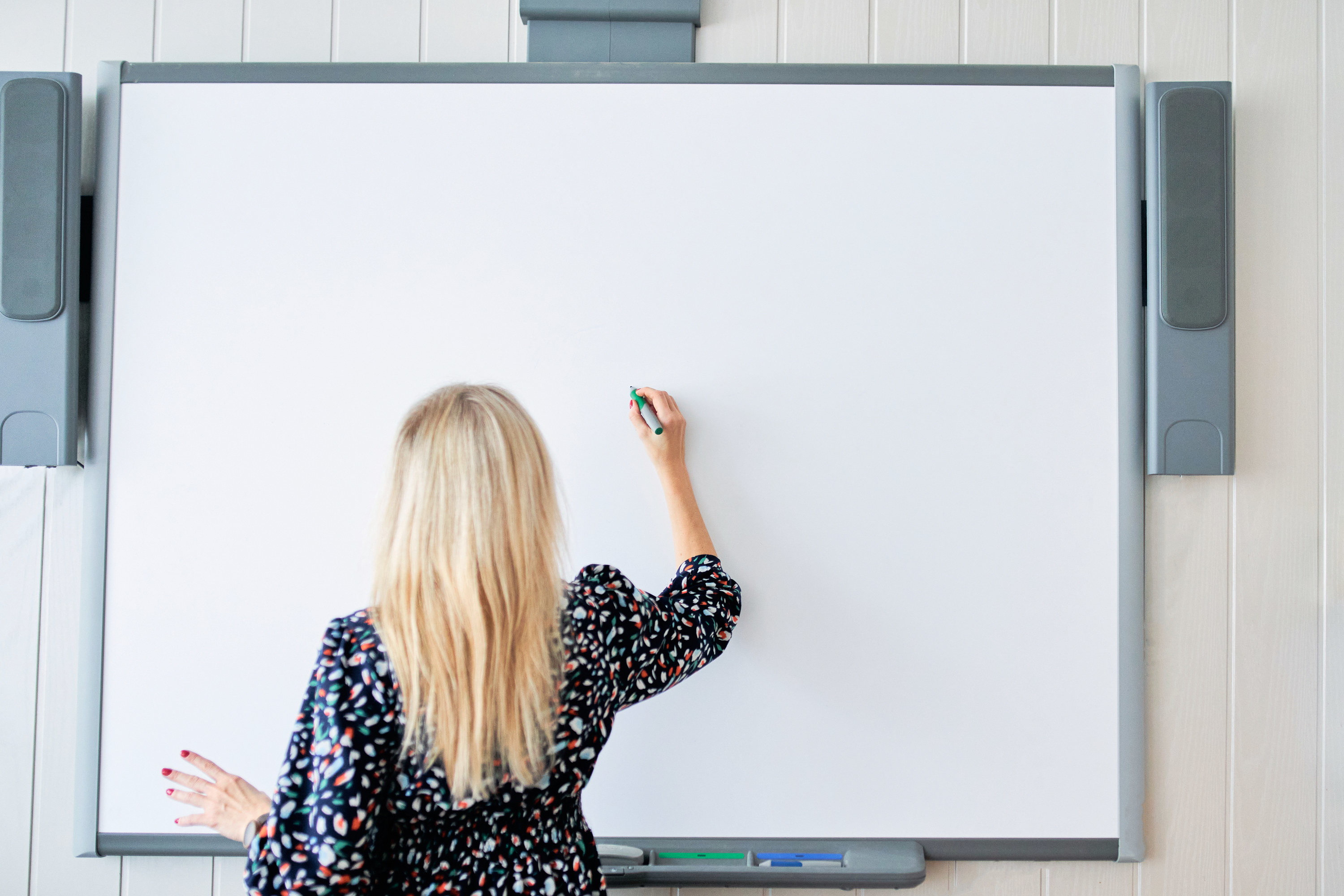 someone about to write on a whiteboard