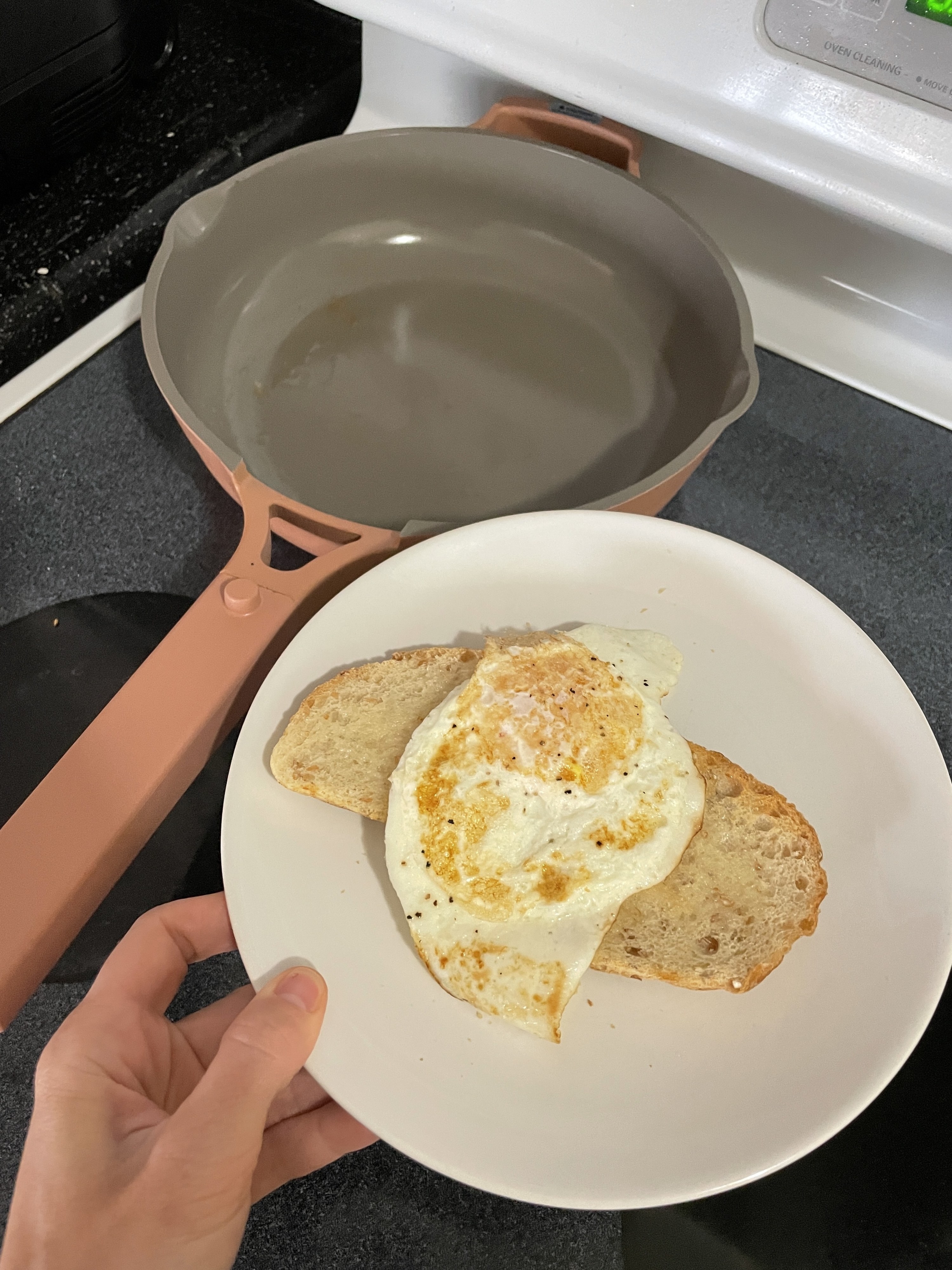 Perfect-looking over-easy egg on a plate with bread