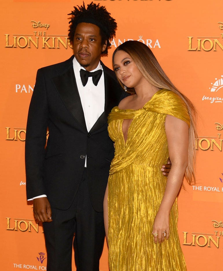 Jay-Z in a bow tie with his arm around Beyoncé&#x27;s waist on the red carpet