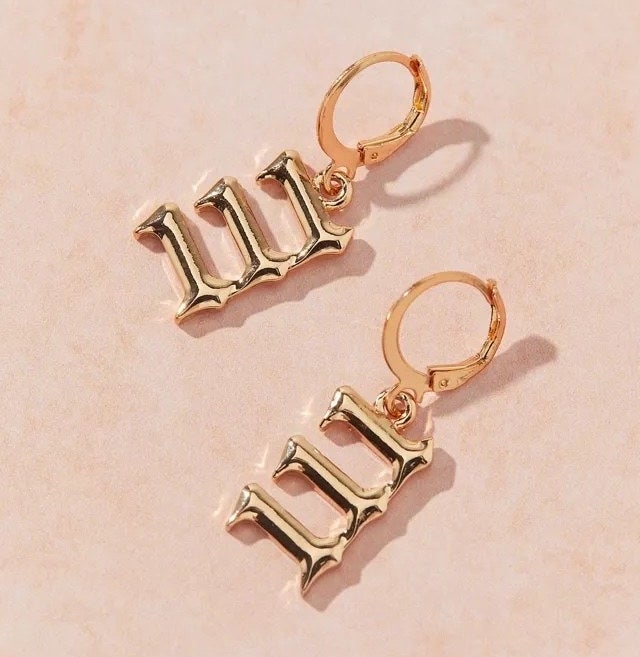 the earrings against a plain background
