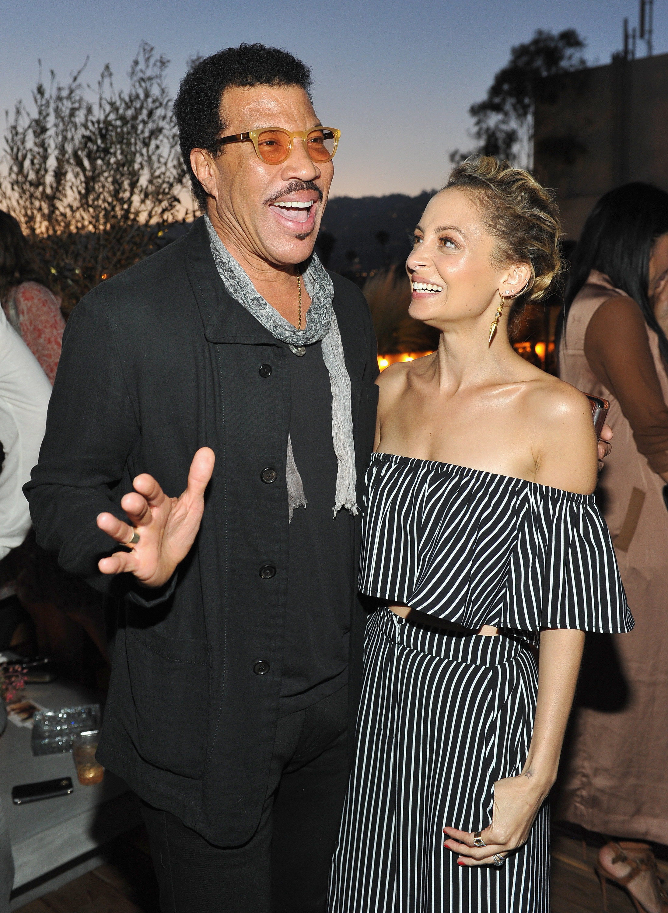 Lionel Richie and Nicole Richie pose together at the House of Harlow 1960 x REVOLVE event on June 2, 2016