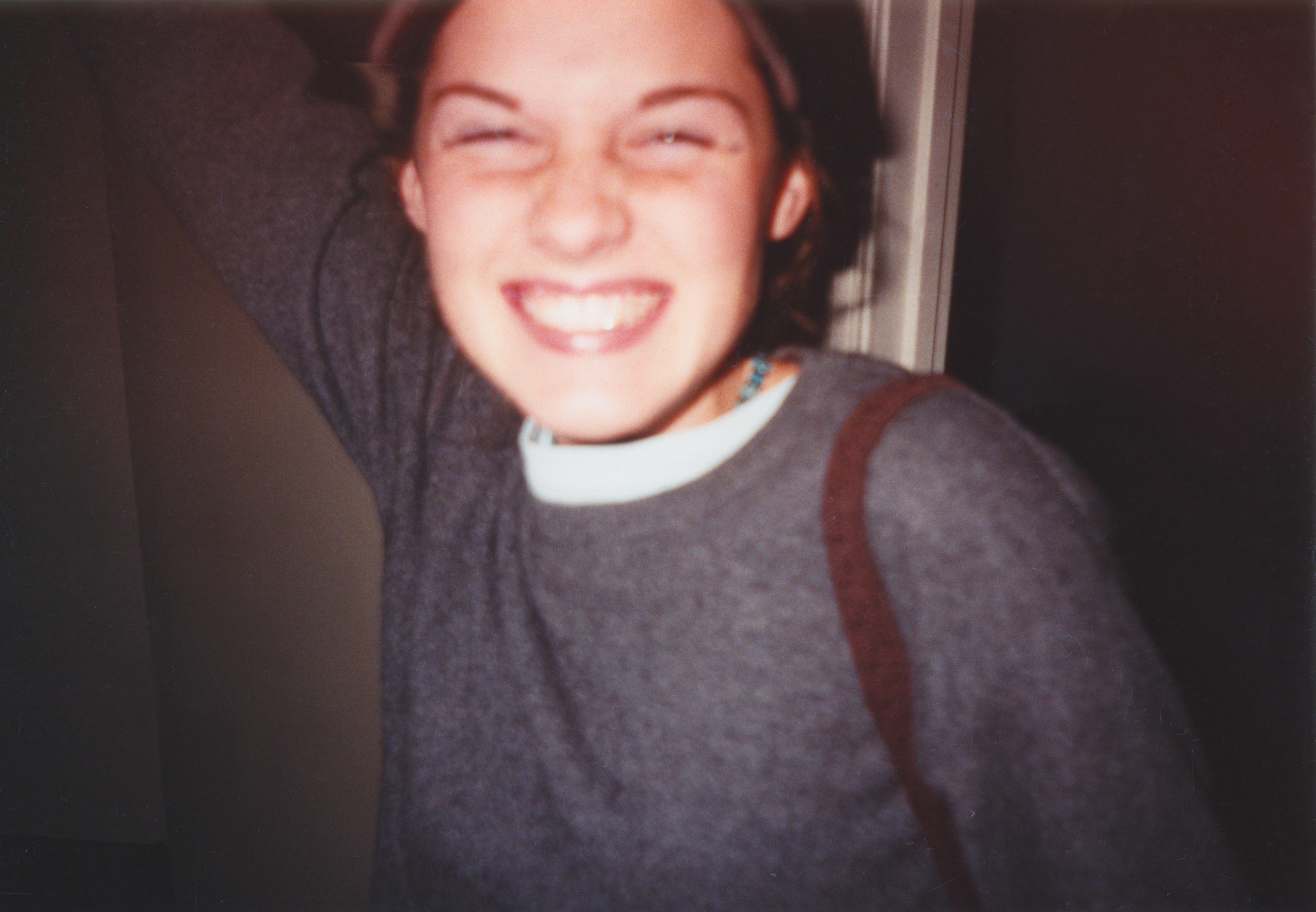 a teen smiling at the camera