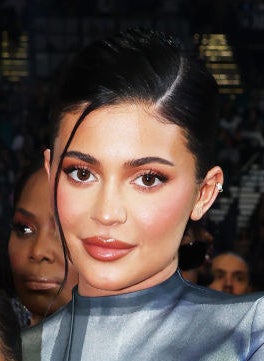 close up of Kylie wearing a sleek low bun