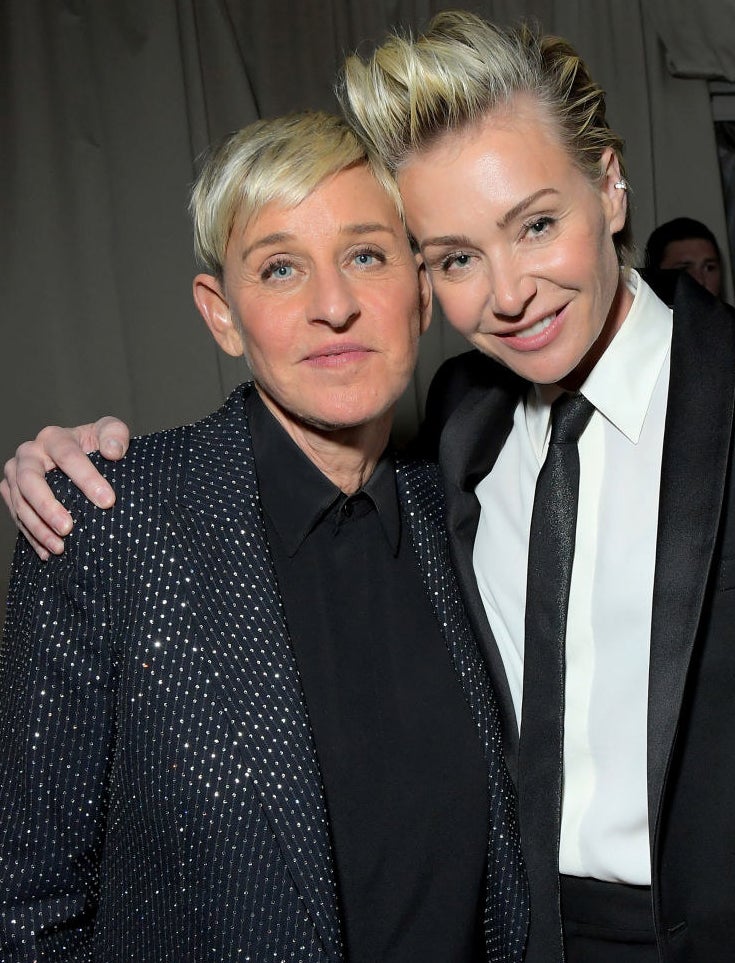 Ellen and Portia standing with their heads together