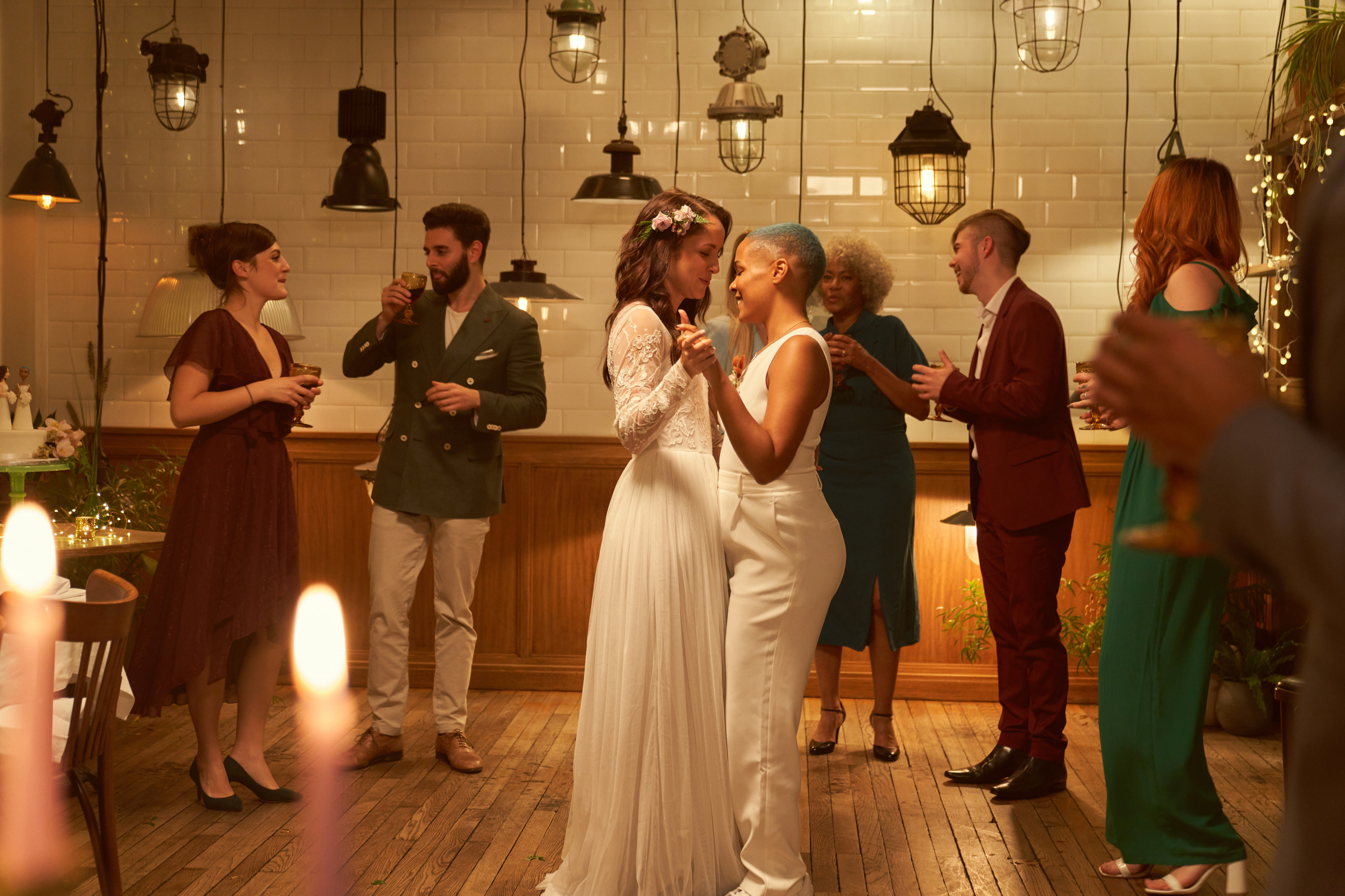 Two brides dancing together