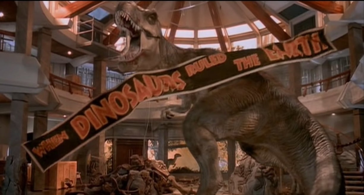 A T-Rex roaring with a banner falling in front of her in &quot;Jurassic Park&quot;