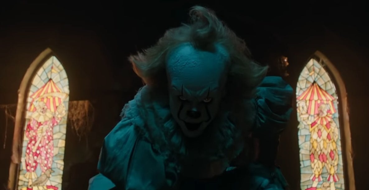 Pennywise crouching in a dark room in &quot;It&quot; (2017)