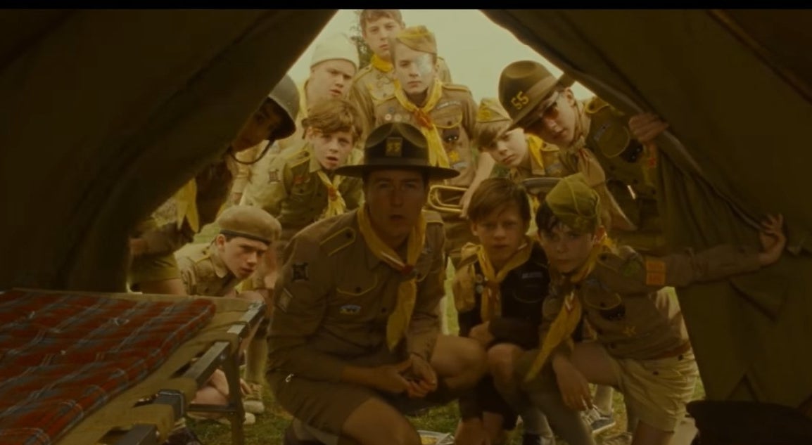 Scout Master Ward and his scouts looking into a tent in &quot;Moonrise Kingdom&quot;