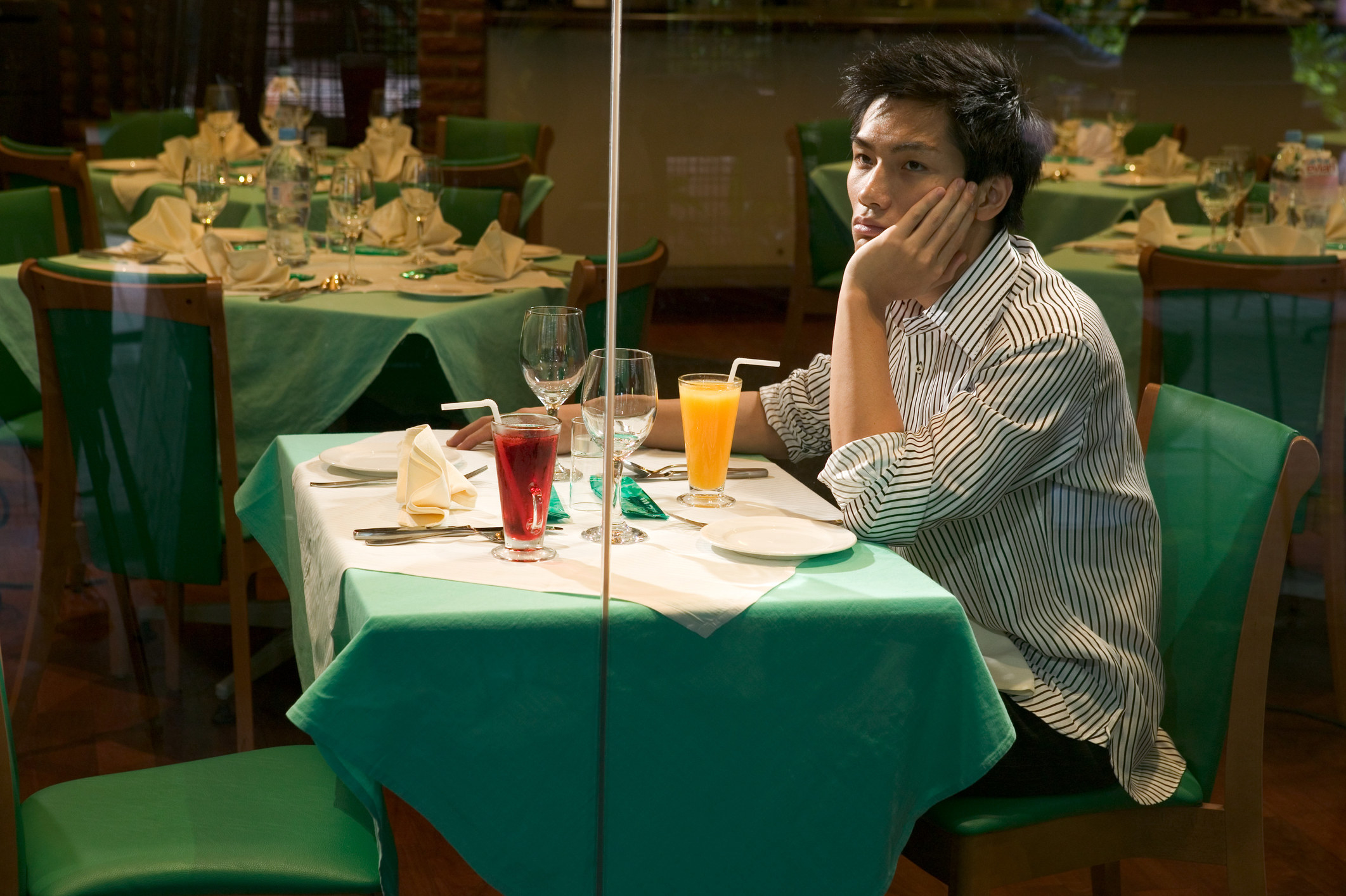 man sits alone at a table for two