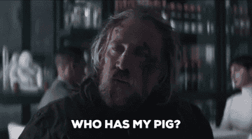 Nicholas Cage with bruises with the words &#x27;who has my pig?&#x27;
