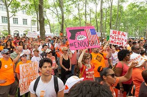 A group of protesters organized by Everytown wearing orange and protesting gun violence