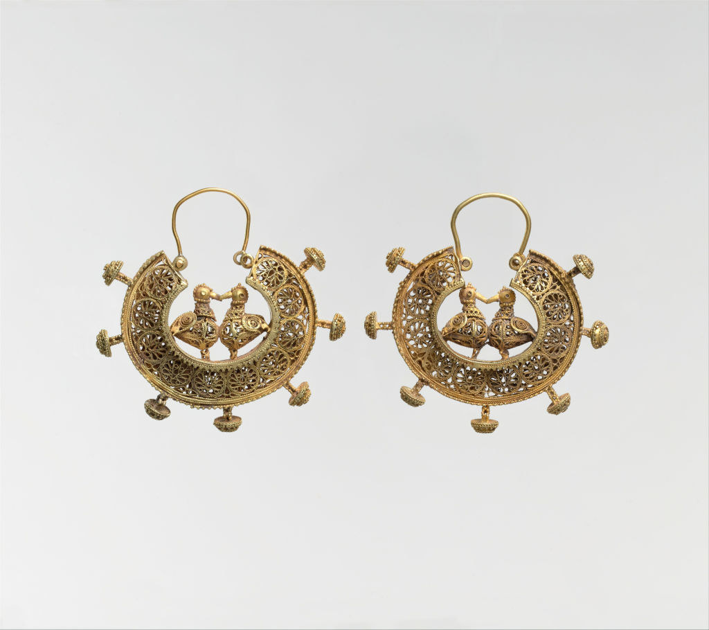 gold earrings with ducks kissing in the middle of a semi-circular design