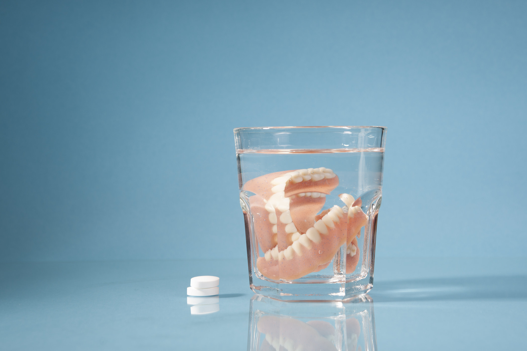 dentures in glass of water