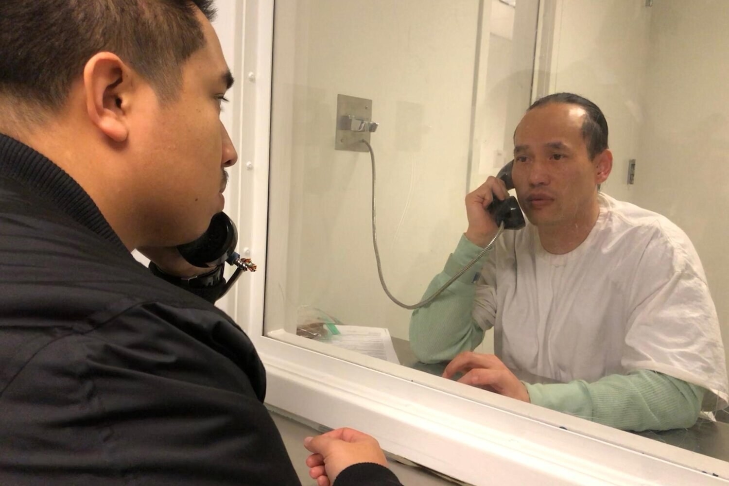 Activist Nathaniel Tan visits Borey “Peejay” Ai while in ICE custody in 2017.