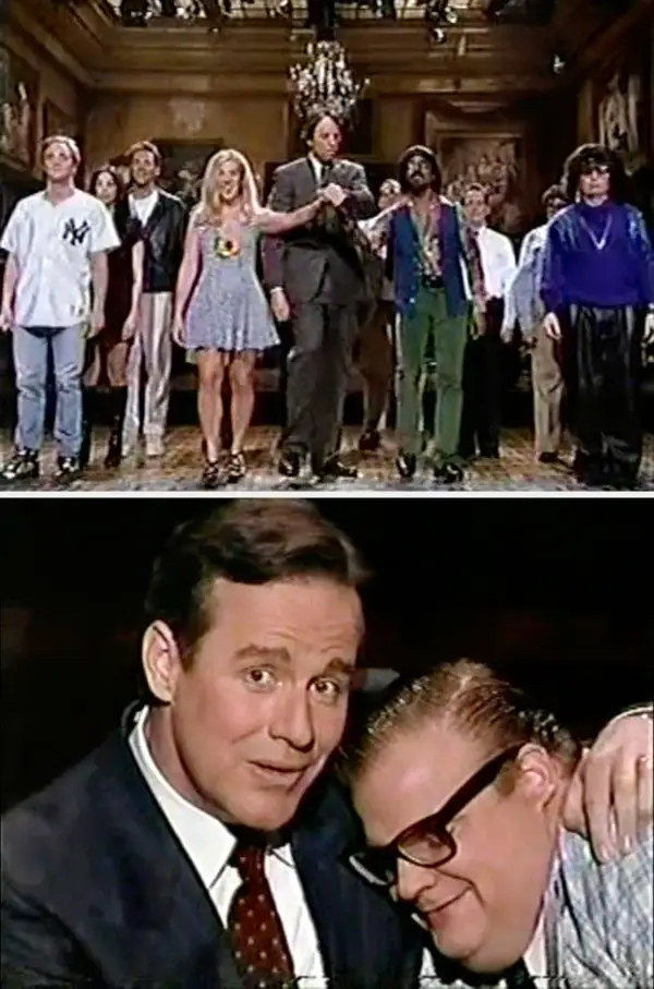 Phil Hartman holds Chris Farley and looks into the camera