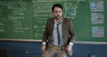 Charlie Day as Andy Campbell walking in front of his blackboard in &quot;Fist Fight&quot;