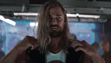 Chris Hemsworth Thor popping his collar with a stern look on his face