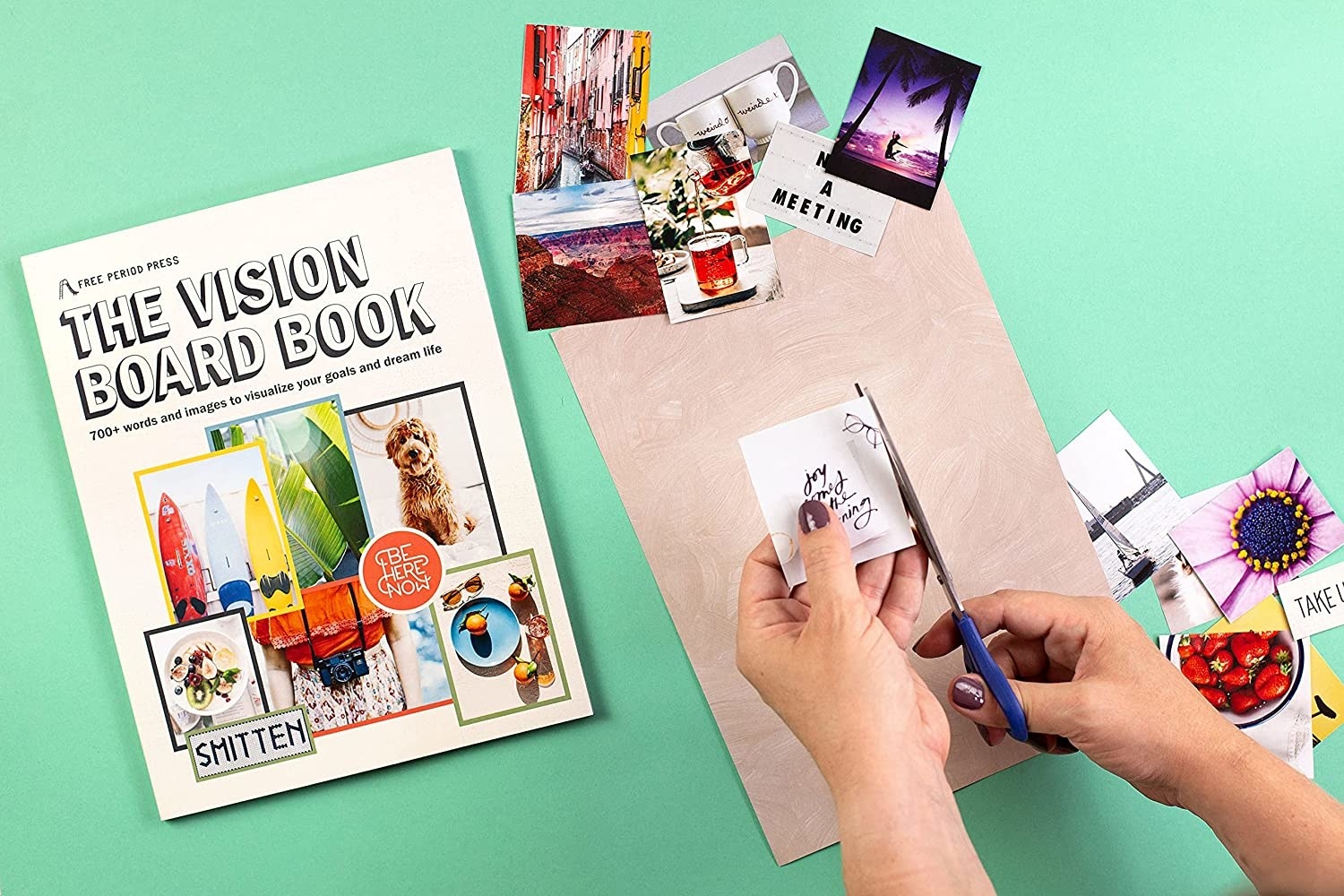 model cutting paper from the book to create a vision board