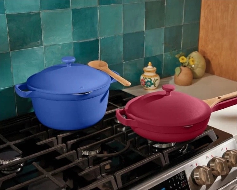 the blue perfect pot and dark pink always pan on a stovetop