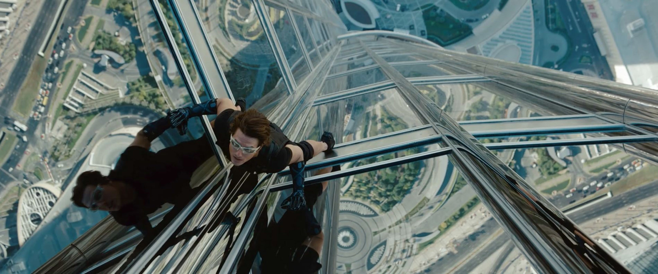 Ethan Hunt scales the side of a tall building
