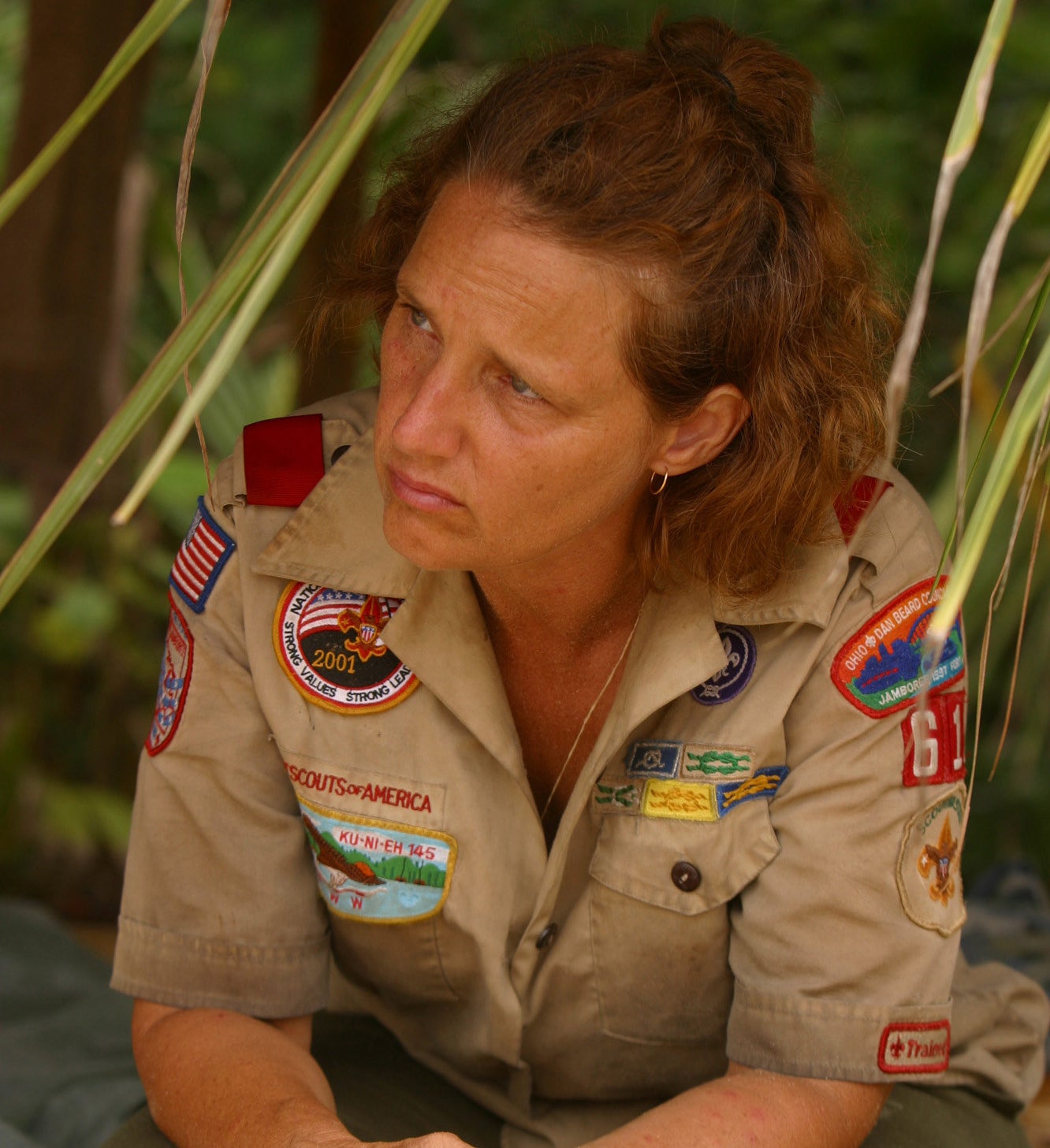 Lillian sits in a Boy Scouts uniform