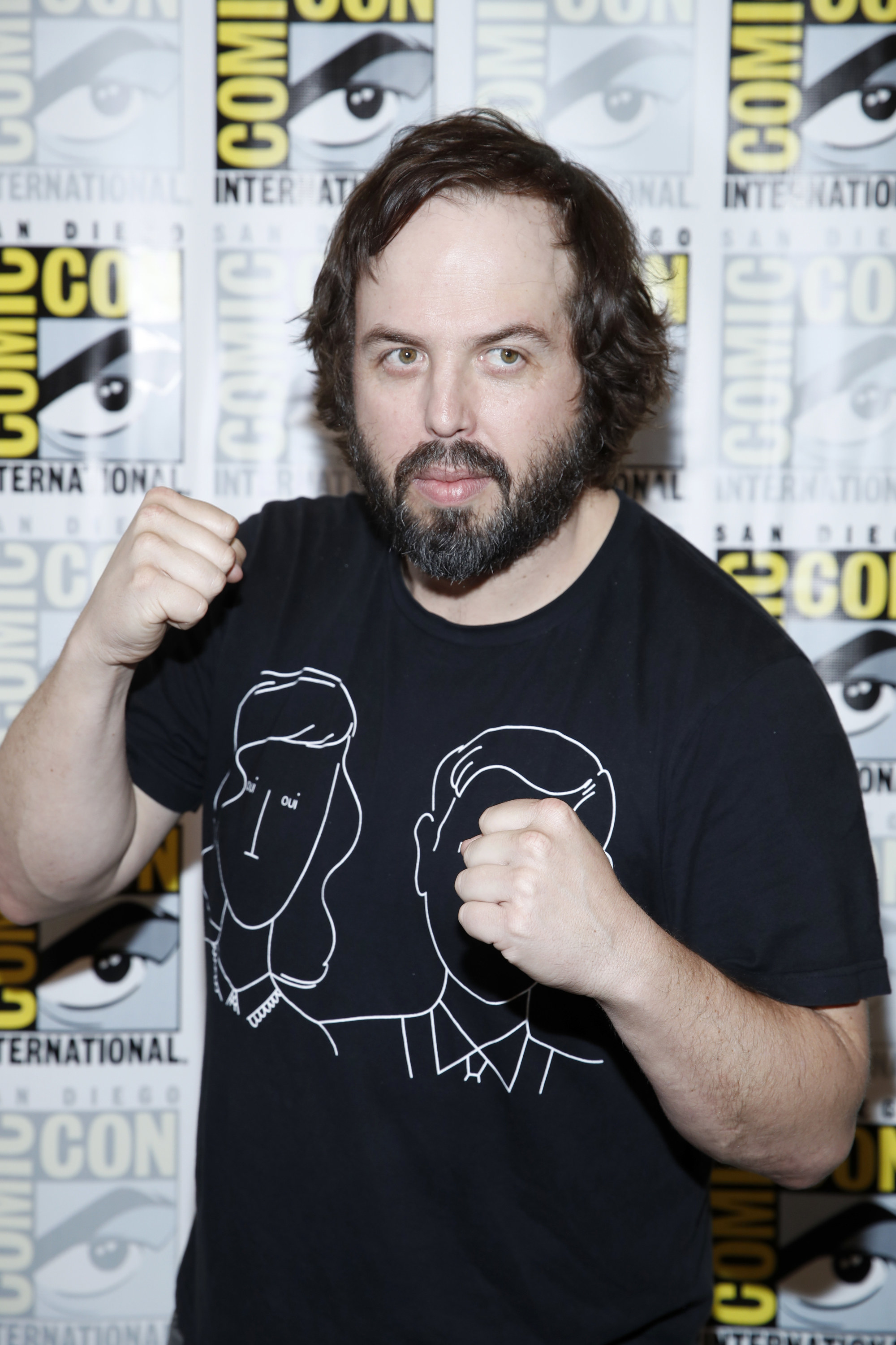 Angus Sampson shows two fists