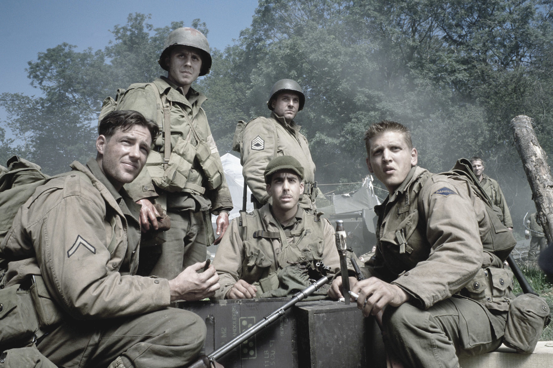The soldiers sitting together in the film