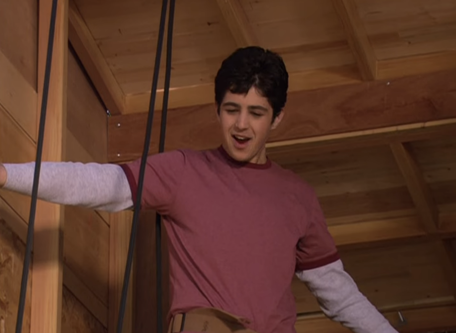 Josh standing in the treehouse they&#x27;re building and looking down