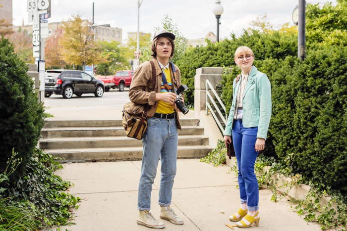 Joe Keery and Rae Gray stand on a sidewalk