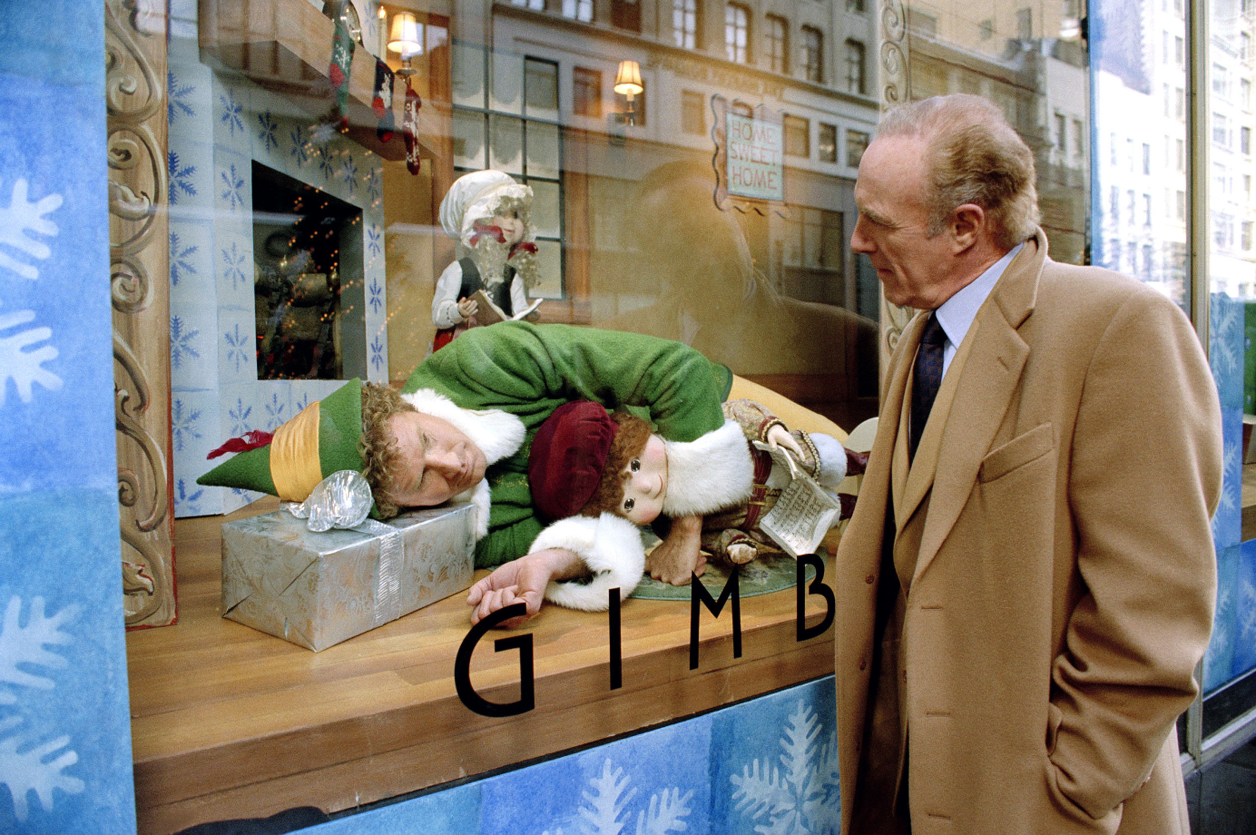Walter Hobbs looks at Buddy in the Gimbels store window