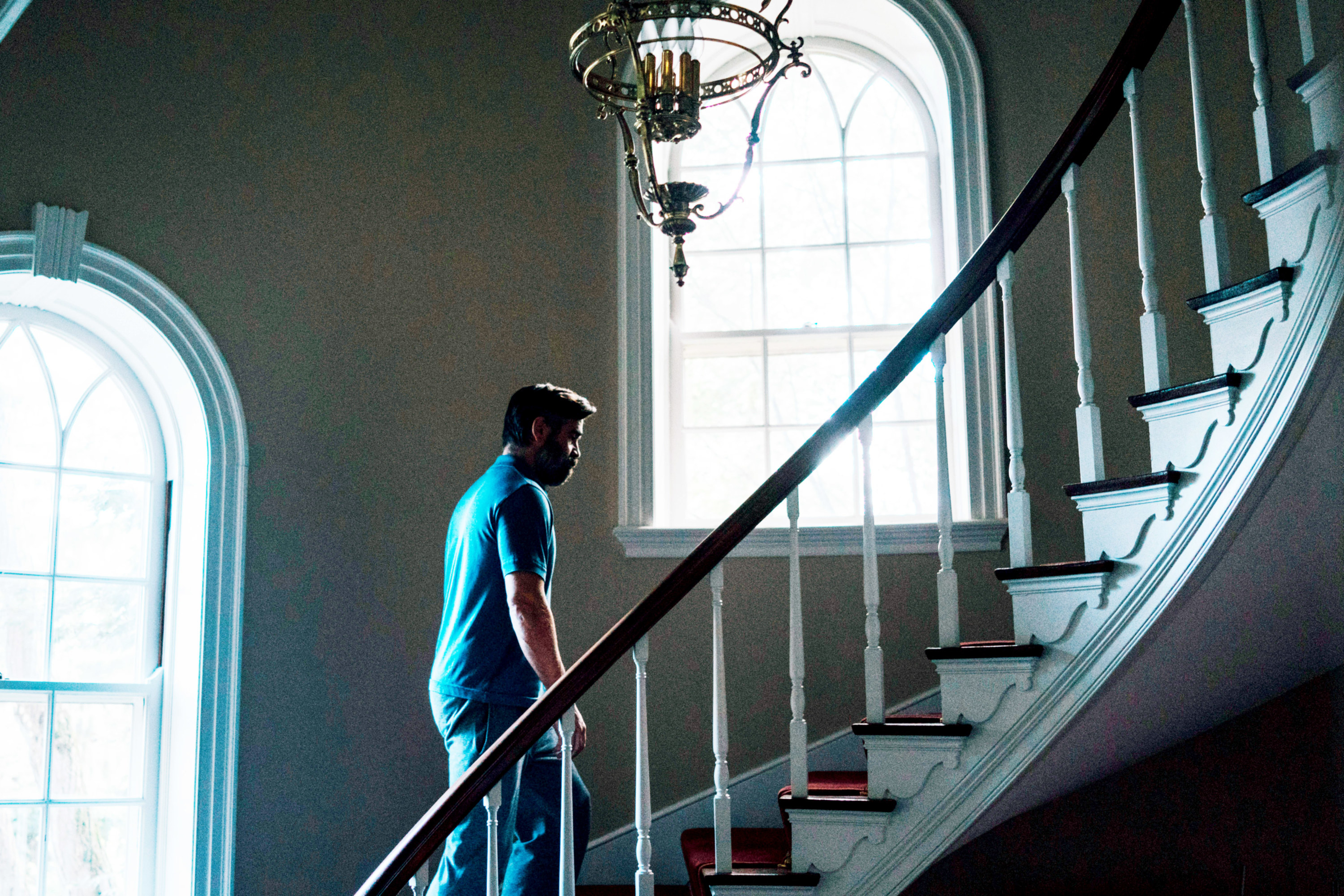 Colin Farrell walks up a staircase