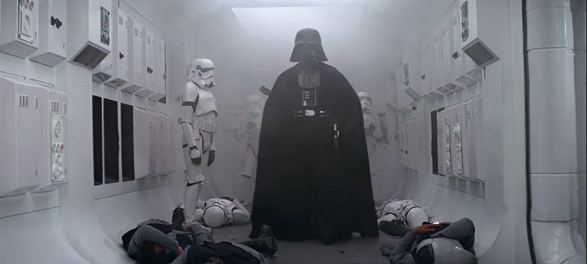 Darth Waver standing inside a rebel ship with dead soldiers beneath him in &quot;Star Wars: Episode IV - A New Hope&quot;