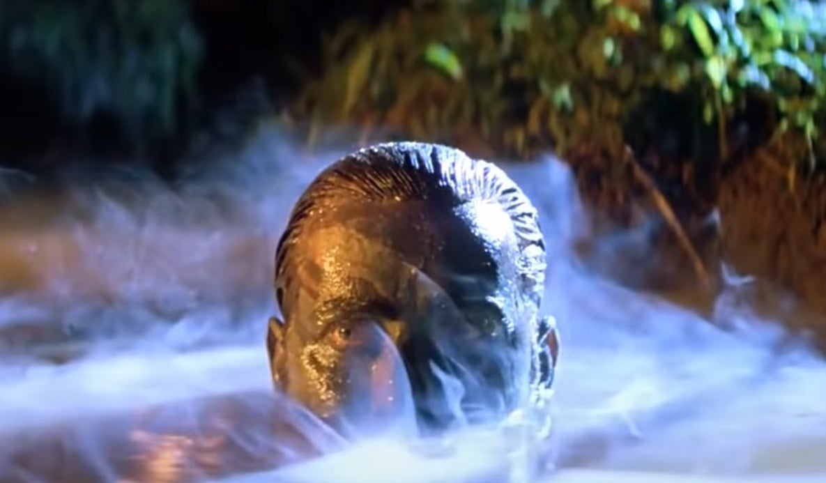 Willard emerging from the foggy river with mud on his face in &quot;Apocalypse Now&quot;