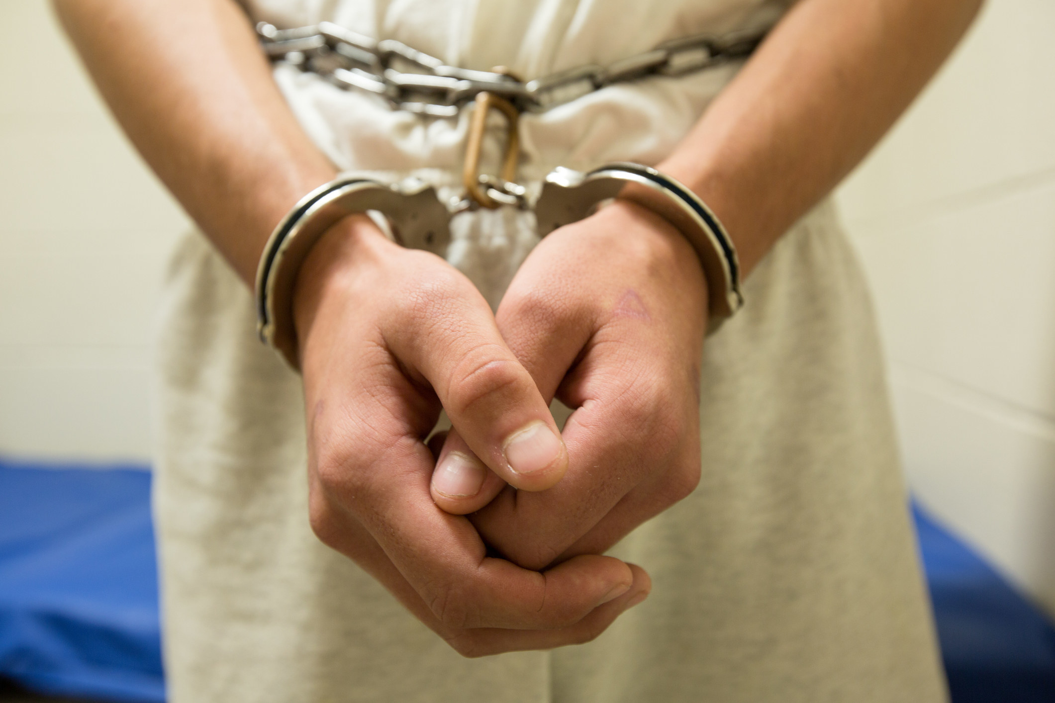 A person&#x27;s hands in handcuffs